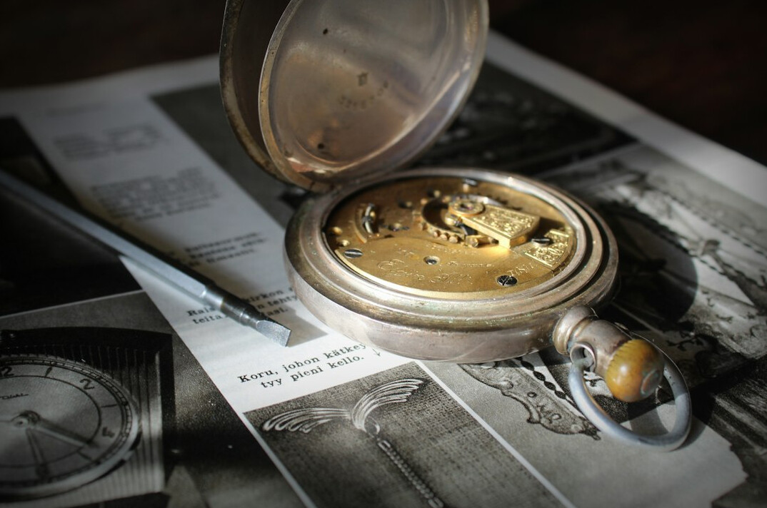 Old map and compass on a wooden table