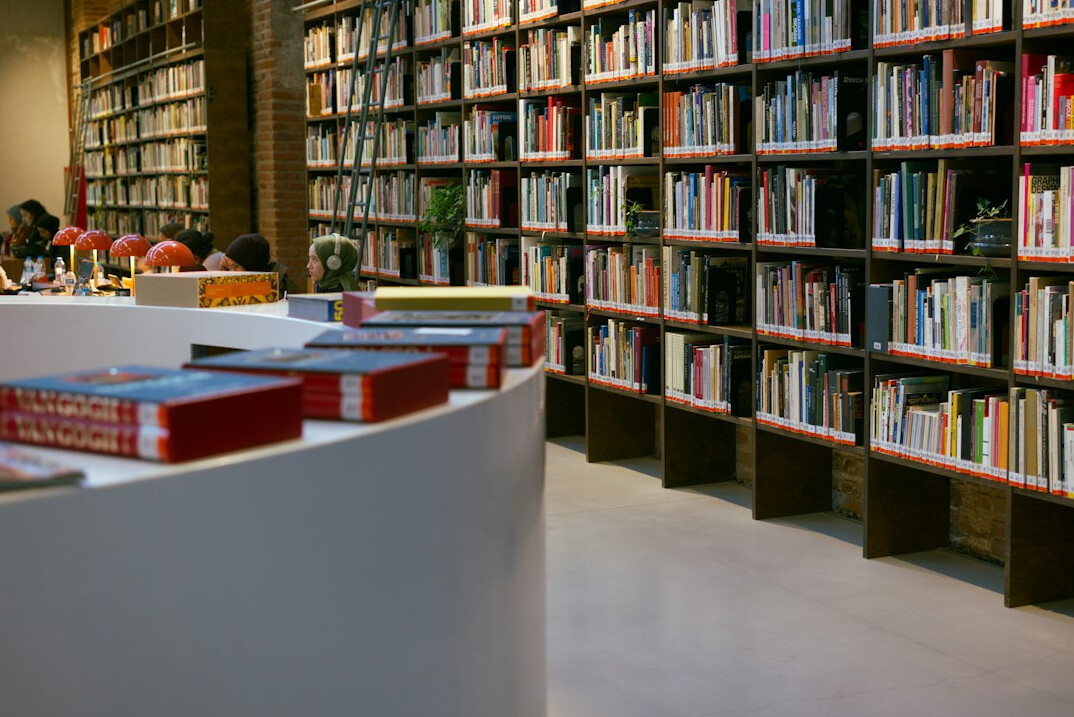 Rows of books on a library shelf close-up